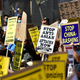 Activists gather for a demonstration at city hall in Los Angeles on March 27, 2021.